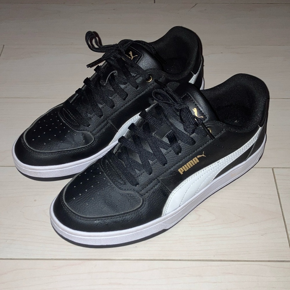 Puma Black and White Sneakers with Gold Accents